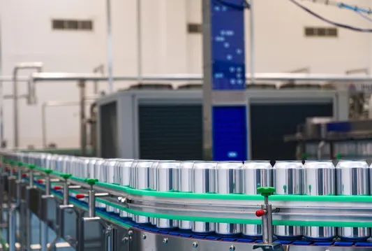 Aluminium cans moving on the canning line